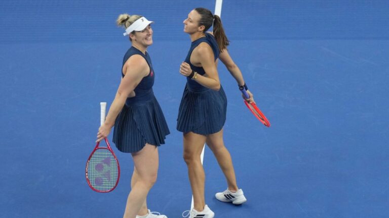 Gabriela Dabrowski, of Canada, and Luisa Stefani, of Brazil celebrate after winning the women's doubles final match against Katerina Siniakova, of the Czech Republic, and Zhang Shuai, of China at the China Open tennis tournament in Beijing, Sunday, Oct. 11, 2026. (Andy Wong/AP)