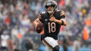 Chicago Bears quarterback Caleb Williams (18) runs with the football during the second half of an NFL football game against the Minnesota Vikings in Chicago, Sunday, Sept. 20, 2026. (Nam Y. Huh/AP)