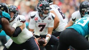 Houston Texans quarterback C.J. Stroud (7) looks to handoff during a NFL football game against the Jacksonville Jaguars in London, Tuesday, Oct. 13, 2026. (Adam Bettcher/AP)