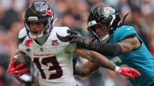 Houston Texans wide receiver Jaylin Noel (13) is challenged by Jacksonville Jaguars safety Antonio Johnson (6) during an NFL football game in London, Sunday, Oct. 18, 2026. (Kin Cheung/AP)