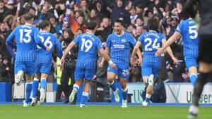 Brighton's Diego Gomez, centre, celebrates scoring during the English Premier League soccer match between Brighton and Hove Albion and Crystal Palace in Brighton, England, Sunday, Oct. 18, 2026. (Gareth Fuller/PA via AP)