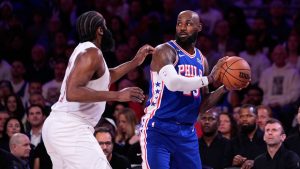 Philadelphia 76ers' LeBron James tries to get past Cleveland Cavaliers' James Harden during the first half of an NBA basketball game Thursday, Oct. 22, 2026, in Philadelphia. (AP Photo/Matt Slocum)