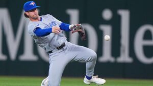 Toronto Blue Jays second baseman Ernie Clement throws to first base for an out against Texas Rangers' Nicky Lopez during the third ninning of a baseball game, Sunday, Sept. 20, 2026, in Arlington, Texas. (AP Photo/LM Otero)
