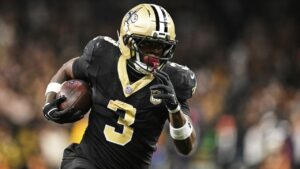 New Orleans Saints running back Travis Etienne Jr. (3) carries the ball during the second half of an NFL football game against the Las Vegas Raiders in New Orleans, Sunday, Sept. 27, 2026. (AP Photo/Ella Hall)