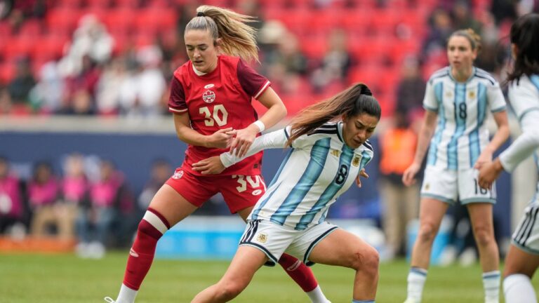 Argentina midfielder Daiana Falfán (8) fights for control of the ball with Canada forward Kaylee Hunter (30) during the first half of a SheBelieves Cup women's soccer match, Saturday, March 7, 2026, in Harrison, N.J. (AP Photo/Yuki Iwamura)