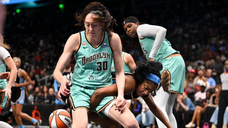 Atlanta Dream forward Angel Reese (5) and New York Liberty forward Breanna Stewart (30) fight for a rebound during the second half in Game 2 of the WNBA basketball semifinals, Wednesday, Oct. 7, 2026, in Atlanta. (AP Photo/Daniel Varnado)