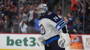 Winnipeg Jets goalie Stuart Skinner in the third period of a preseason NHL hockey game Friday, Sept. 25, 2026, in Denver. (AP Photo/David Zalubowski)