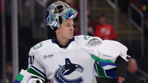 Vancouver Canucks goaltender Leevi Merilainen reacts after giving up a goal during the second period of an NHL hockey game against the New Jersey Devils, Saturday, Oct. 10, 2026, in Newark, N.J. (AP Photo/Adam Hunger)