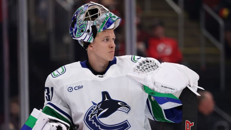 Vancouver Canucks goaltender Leevi Merilainen reacts after giving up a goal during the second period of an NHL hockey game against the New Jersey Devils, Saturday, Oct. 10, 2026, in Newark, N.J. (AP Photo/Adam Hunger)