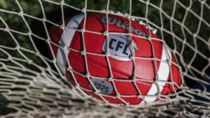 Canadian Football League logo on a football at opening day of CFL training camp in Guelph, Ont., on Sunday, May 11, 2025. THE CANADIAN PRESS/Nick Iwanyshyn