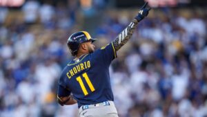 Milwaukee Brewers left fielder Jackson Chourio celebrates his solo home run take flight during the first inning of Game 3 of baseball's National League Championship Series between the Milwaukee Brewers and the Los Angeles Dodgers, Wednesday, Oct. 14, 2026, in Los Angeles. (AP Photo/Gregory Bull)