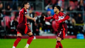 Toronto FC's Matheus Pereira (right) celebrates his goal against Orlando City SC with Theo Corbeanu (7) during second half MLS soccer action in Toronto on Wednesday, Oct. 14, 2026. THE CANADIAN PRESS/Frank Gunn