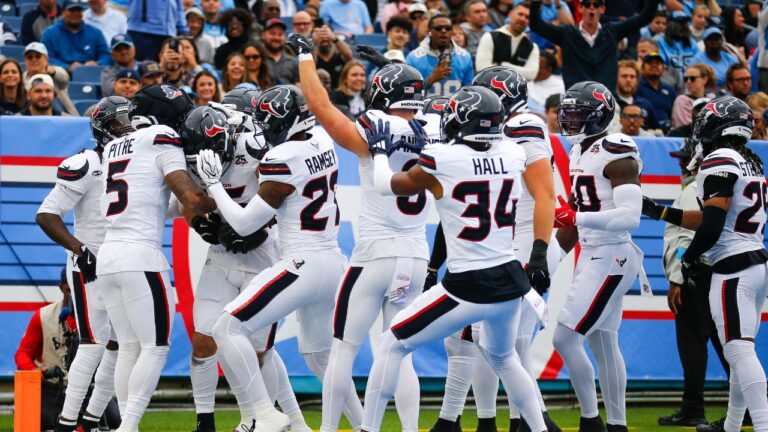 Houston Texans linebacker Jake Hansen (35) celebrates an interception with teammates during the first half of an NFL football game against the Tennessee Titans in Nashville, Tenn., Sunday, Oct. 11, 2026. (Stew Milne/AP)