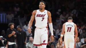 Miami Heat forward Giannis Antetokounmpo (7) looks up at the scoreboard during the first half of an NBA preseason basketball game against the New Orleans Pelicans Thursday, Oct. 8, 2026, in Miami. (AP Photo/Marta Lavandier)
