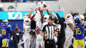 Arizona Cardinals kicker Chad Ryland, top, is congratulated by teammates after kicking the game winning field goal against the Los Angeles Rams during the second half of an NFL football game in Inglewood, Calif., Sunday, Oct. 18, 2026. (AP Photo/Gregory Bull)