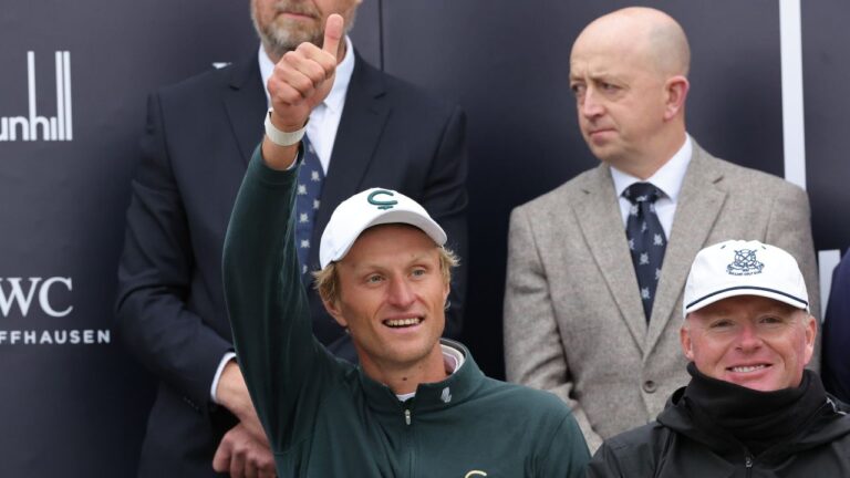 Adrian Meronk of Poland celebrates his victory with caddie Stuart Beck, right, at the Old Course at St Andrews, Scotland, Sunday Oct. 4, 2026. (Steve Welsh/AP)