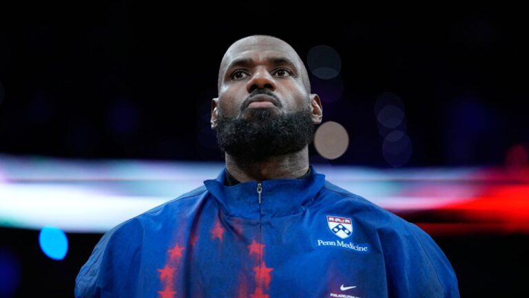 Philadelphia 76ers' LeBron James stands before a preseason NBA basketball game against the Boston Celtics Friday, Oct. 16, 2026, in Philadelphia. (Matt Slocum/AP)