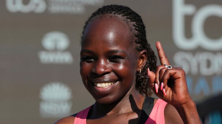 FILE - Peres Jepchirchir of Kenya reacts after crossing the finish line at the Opera House to win the women's Sydney Marathon, in Sydney, Sunday, Aug. 30, 2026. (Mark Baker/AP Photo/ File)