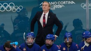 FILE - United States head coach John Wroblewski looks up at the scoreboard during the third period of the women's ice hockey gold medal game against Canada at the 2026 Winter Olympics, in Milan, Italy, Thursday, Feb. 19, 2026. (Carolyn Kaster/AP, File)