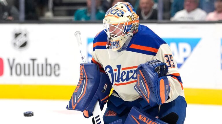 Edmonton Oilers goaltender Tristan Jarry blocks a shot during the first period of an NHL hockey game against the San Jose Sharks in San Jose, Calif., Saturday, Oct. 10, 2026. (AP Photo/Tony Avelar)