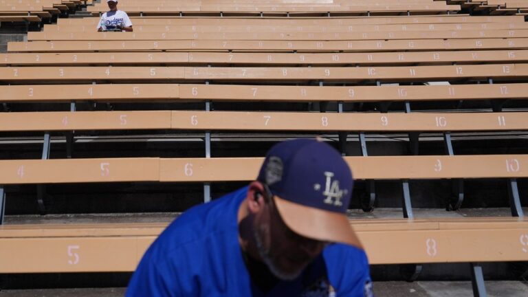 Empty seats sit under the heat before Game 1 of a National League Division Series baseball game against the Atlanta Braves Saturday, Oct. 3, 2026, in Los Angeles. (AP Photo/Jae C. Hong)