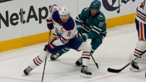 Edmonton Oilers centre Connor McDavid (97) skates with the puck against San Jose Sharks centre Alexander Wennberg (21) an NHL hockey game in San Jose, Calif., Saturday, Feb. 28, 2026. (Jeff Chiu/AP)