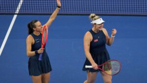 Gabriela Dabrowski, of Canada, and Luisa Stefani, of Brazil celebrate after winning the women's doubles final match against Katerina Siniakova, of the Czech Republic, and Zhang Shuai, of China at the China Open tennis tournament in Beijing, Sunday, Oct. 11, 2026. (AP Photo/Andy Wong)