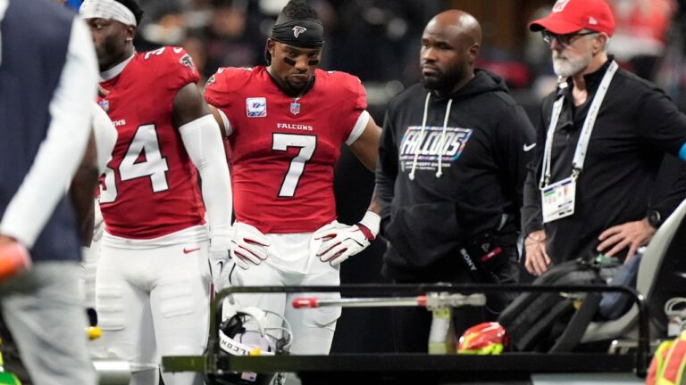 Atlanta Falcons running back Bijan Robinson (7) waits as Falcons linebacker Kendal Daniels is attended to after being injured during the second half of an NFL football game between the Falcons and the Chicago Bears in Atlanta, Sunday, Oct. 18, 2026. (AP Photo/Mike Stewart)