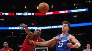 Toronto Raptors' Ja'kobe Walter (14) battles for the ball against Orlando Magic's Franz Wagner (22) during second half NBA basketball action in Toronto on Wednesday, Oct. 28, 2026. (Nathan Denette/CP)
