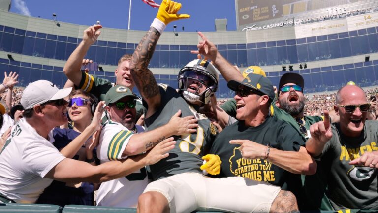 Green Bay Packers' Christian Watson celebrates with fans after catching a touchdown pass during the first half of an NFL game against the Chicago Bears in Green Bay, Wis., Sunday, Oct. 11, 2026. (AP/Mike Roemer)