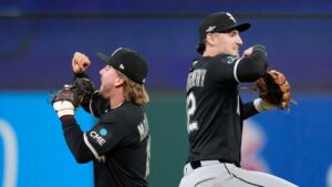 Chicago White Sox's Chase Meidroth, left, and Colson Montgomery, right, celebrate after Game 2 of baseball's American League Division Series against the Cleveland Guardians, Monday, Oct. 5, 2026, in Cleveland. (Sue Ogrocki/AP)
