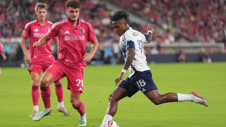 Vancouver Whitecaps' Édier Ocampo (18) shoots as St. Louis City's Dante Polvara (21) defends during the first half of an MLS soccer match Wednesday, Oct. 14, 2026, in St. Louis. (AP Photo/Jeff Roberson)
