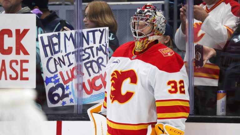 Calgary Flames goaltender Dustin Wolf attends warmups before an NHL hockey game against the Seattle Kraken, Sunday, Oct. 4, 2026, in Seattle. (Jason Redmond/AP)