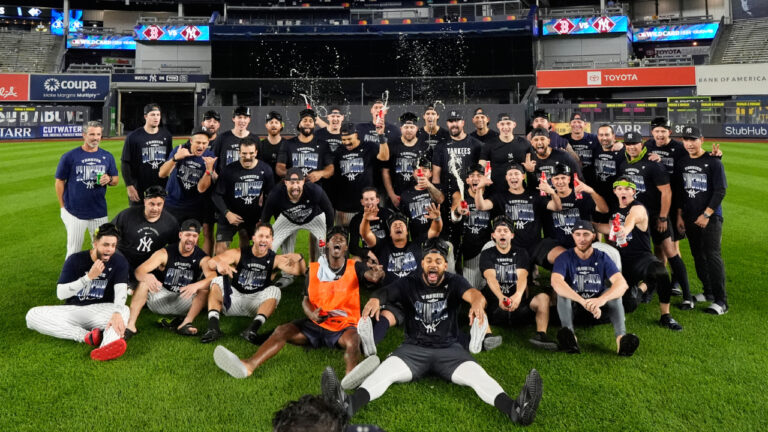The New York Yankees take a group photo on the field to celebrate after winning baseball's American League wild-card series against the Boston Red Sox in Game 2, Wednesday, Sept. 30, 2026, in New York. (Yuki Iwamura/AP)