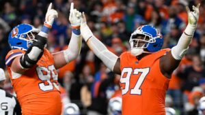 Denver Broncos defensive end Zach Allen and defensive tackle Malcolm Roach, right, react after Allen sacked Seattle Seahawks quarterback Sam Darnold during the second half of an NFL football game in Denver, Thursday, Oct. 15, 2026. (Geneva Heffernan/AP)