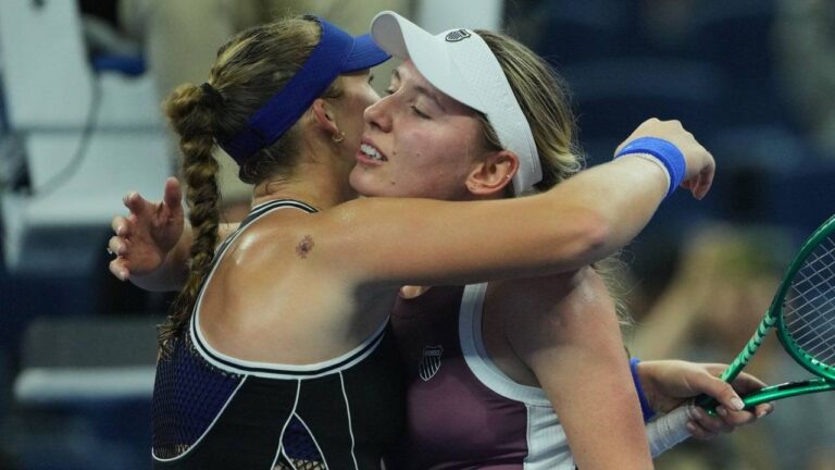 Mirra Andreeva, of Russia, left, hugs Ekaterina Alexandrova, of Russia after winning the quarterfinals of the women's singles match at the China Open tennis tournament in Beijing, Thursday, Oct. 8, 2026.(Achmad Ibrahim/AP)