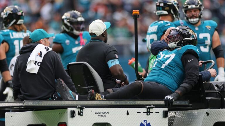 Jacksonville Jaguars offensive tackle Anton Harrison (77) is driven from the field after an injury during an NFL football game against Philadelphia Eagles in London, Sunday, Oct. 11, 2026. (Ian Walton/AP)
