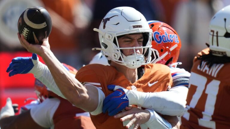 Texas quarterback Arch Manning (16) is hit by Florida linebacker Jaden Robinson (29) as he throw during the first half of an NCAA college football game in Austin, Texas, Saturday, Oct. 17, 2026. (Eric Gay/AP)