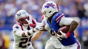 Buffalo Bills running back James Cook III (4) runs against New England Patriots cornerback Marcus Jones (25) in the first half during an NFL football game in Orchard Park, N.Y., Sunday, Oct. 4, 2026. (Carolyn Kaster/AP)