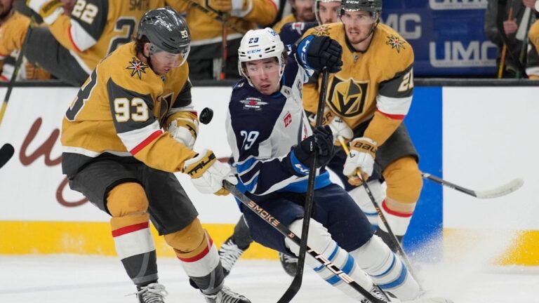 Vegas Golden Knights right wing Mitch Marner (93) and Winnipeg Jets' Brayden Yager vie for the puck during the first period of an NHL hockey game Monday, April 13, 2026, in Las Vegas. (John Locher/AP)