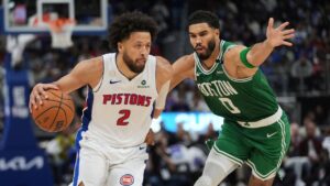 Detroit Pistons guard Cade Cunningham (2) drives on Boston Celtics forward Jayson Tatum (0) in the second half of an NBA basketball game in Detroit, Tuesday, Oct. 20, 2026. (Paul Sancya/AP)