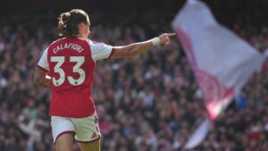 Arsenal's Riccardo Calafiori celebrates after scoring his side's opening goal during the English Premier League soccer match between Arsenal and Leeds United. (Alastair Grant/AP)