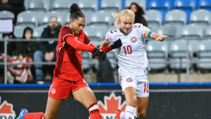 Canada's Jade Rose, left, defends against Denmark's Pernille Harder (10) during first half international friendly soccer action in Montreal, on Friday, Oct. 9, 2026. (Graham Hughes/CP)