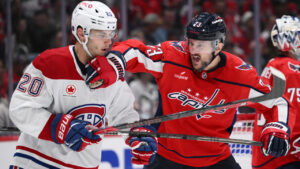 Washington Capitals defenceman Vincent Desharnais, right, and Montreal Canadiens left wing Juraj Slafkovsky (20) battle during the second period of an NHL hockey game, Wednesday, Oct. 14, 2026, in Washington. (Nick Wass/AP)