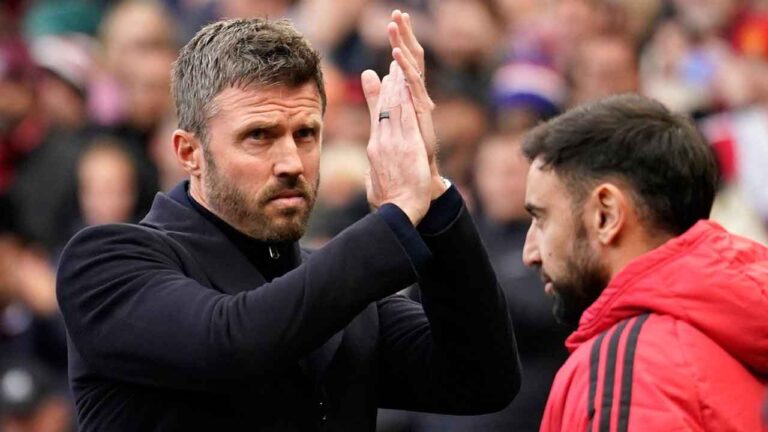 Manchester United's head coach Michael Carrick applauds to supporters ahead of the start of the English Premier League soccer match between Manchester United and Bournemouth in Manchester. (Dave Thompson/AP)