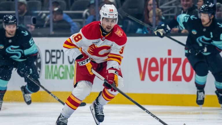 Calgary Flames forward Jonathan Castagna skates with the puck during a preseason NHL hockey game against the Seattle Kraken, Thursday, Sept. 24, 2026, in Seattle. (Stephen Brashear/AP Photo)