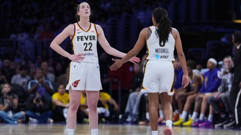 Indiana Fever guard Caitlin Clark (22) and guard Kelsey Mitchell (0) react to a play during the first half of a WNBA basketball game against the Los Angeles Sparks Wednesday, May 13, 2026, in Los Angeles. (Jae C. Hong/AP)
