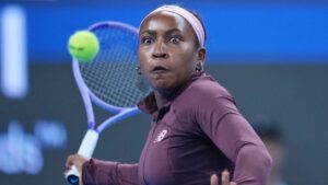 Coco Gauff of the United States, returns a ball to Xinran Sun of China, during the third round of the women's singles match at the China Open tennis tournament in Beijing, Monday, Oct. 5, 2026. (Achmad Ibrahim/AP Photo)