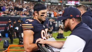 Chicago Bears tight end Cole Kmet (85) is carted off the field after suffering an injury on a pass play during the second half of an NFL football game against the New England Patriots in Chicago, Thursday, Oct. 22, 2026. (Nam Y. Huh/AP)