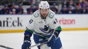 Vancouver Canucks' Paul Cotter (47) during the first period of an NHL hockey game against the New York Islanders Tuesday, Oct. 13, 2026, in Elmont, N.Y. (Frank Franklin II/AP Photo)